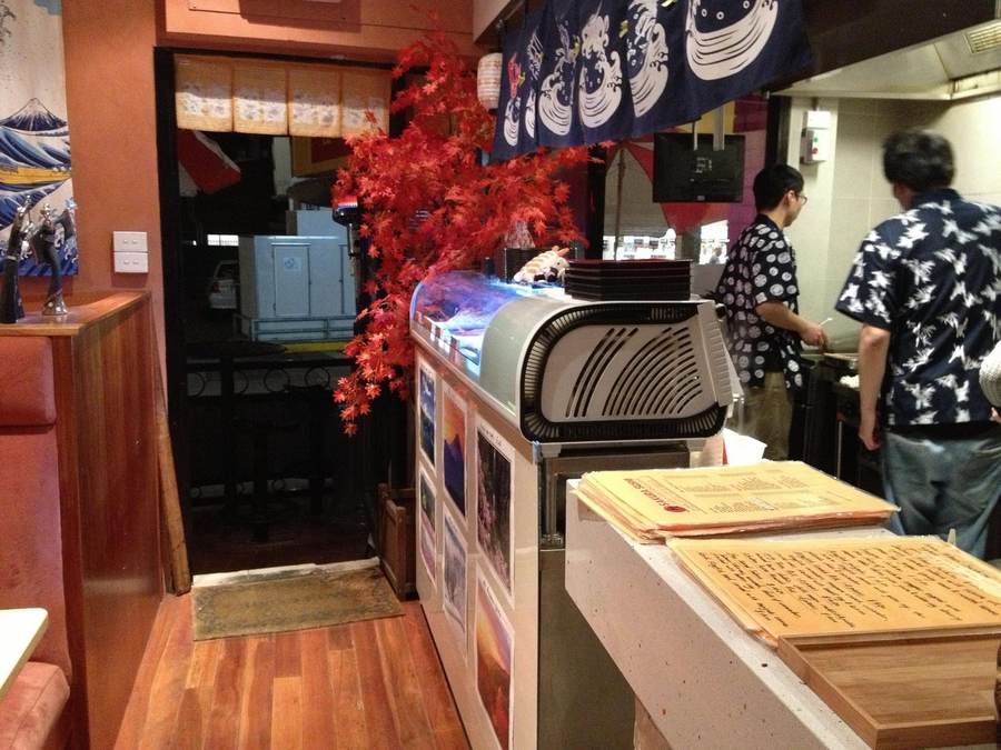 The entrance and sushi counter at Sakura Sushi